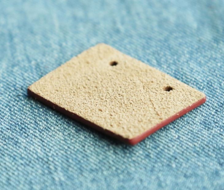 factory bulk red color debossed logo real leather label